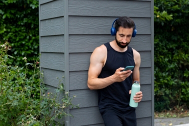 medium-shot-man-wearing-headphones